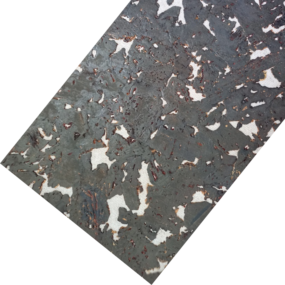 The image shows a cork tile displayed at an angle, highlighting its textured surface. It features an irregular, abstract pattern in shades of dark gray, white, and brown, giving it a natural, modern, and slightly industrial look.
